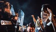 Police officers face off with protestors  on the I-85