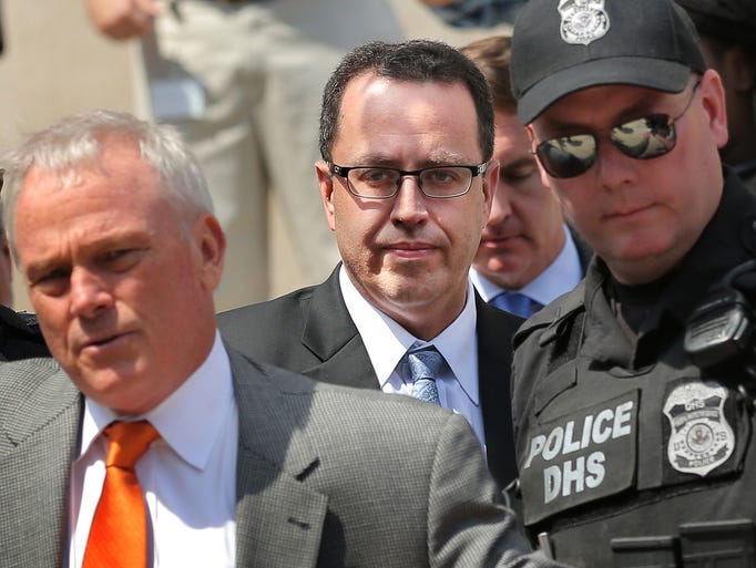 Jared Fogle, former pitchman for Subway, is escorted