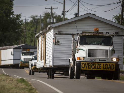 May 12, 2016: Two of the four homes where members of the Rhoden family were shot and killed on the morning of April 22, are transported from Union Hill Road properties to a warehouse in Waverly, which is being used as a command center for authorities