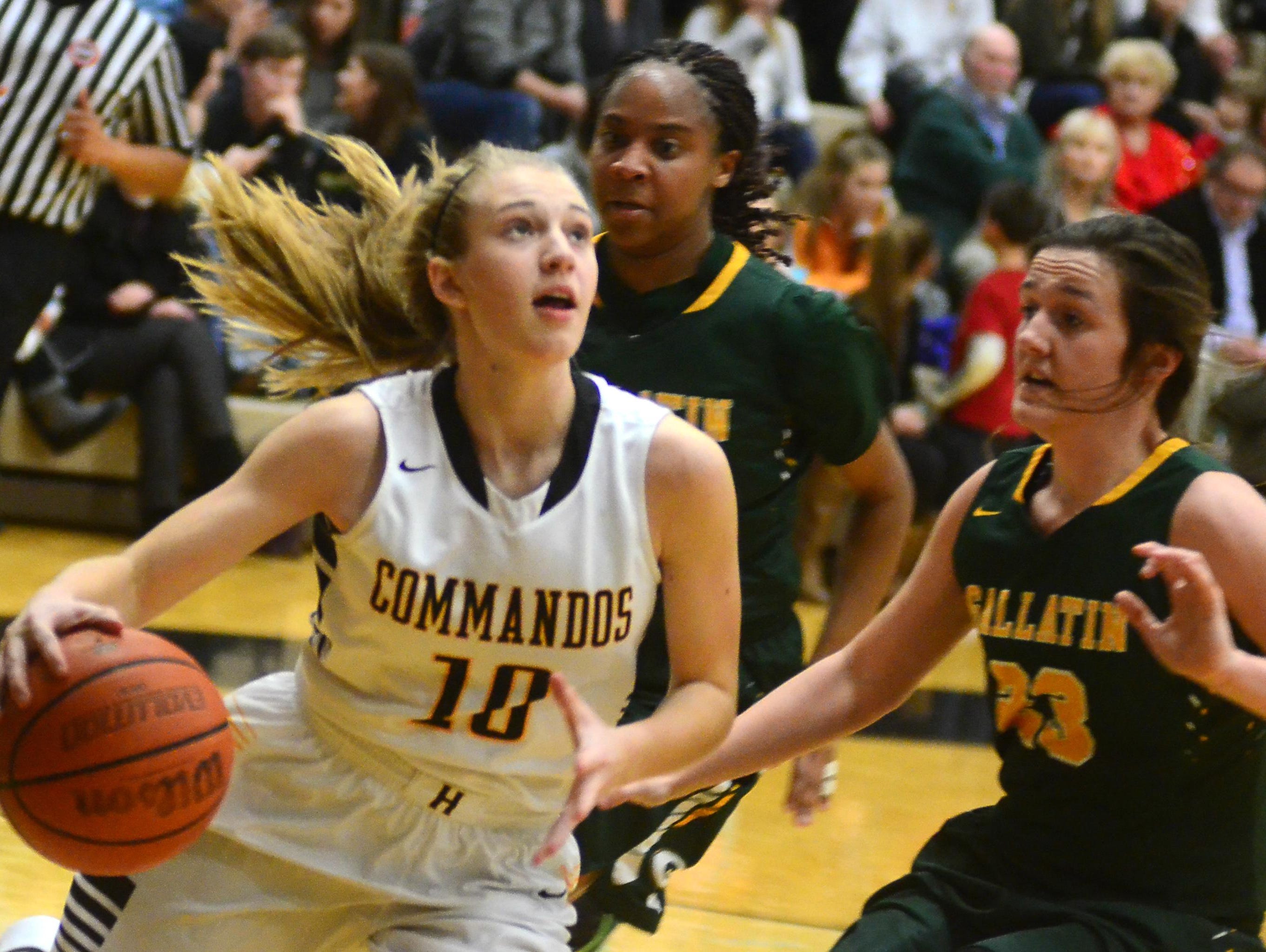 Hendersonville High sophomore guard Brooke Long drives to the basket as Gallatin junior Savannah Link (23) defendsd during second-quarter action. Long scored 19 points.
