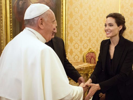 Pope Francis greets Angelina Jolie, at the Vatican
