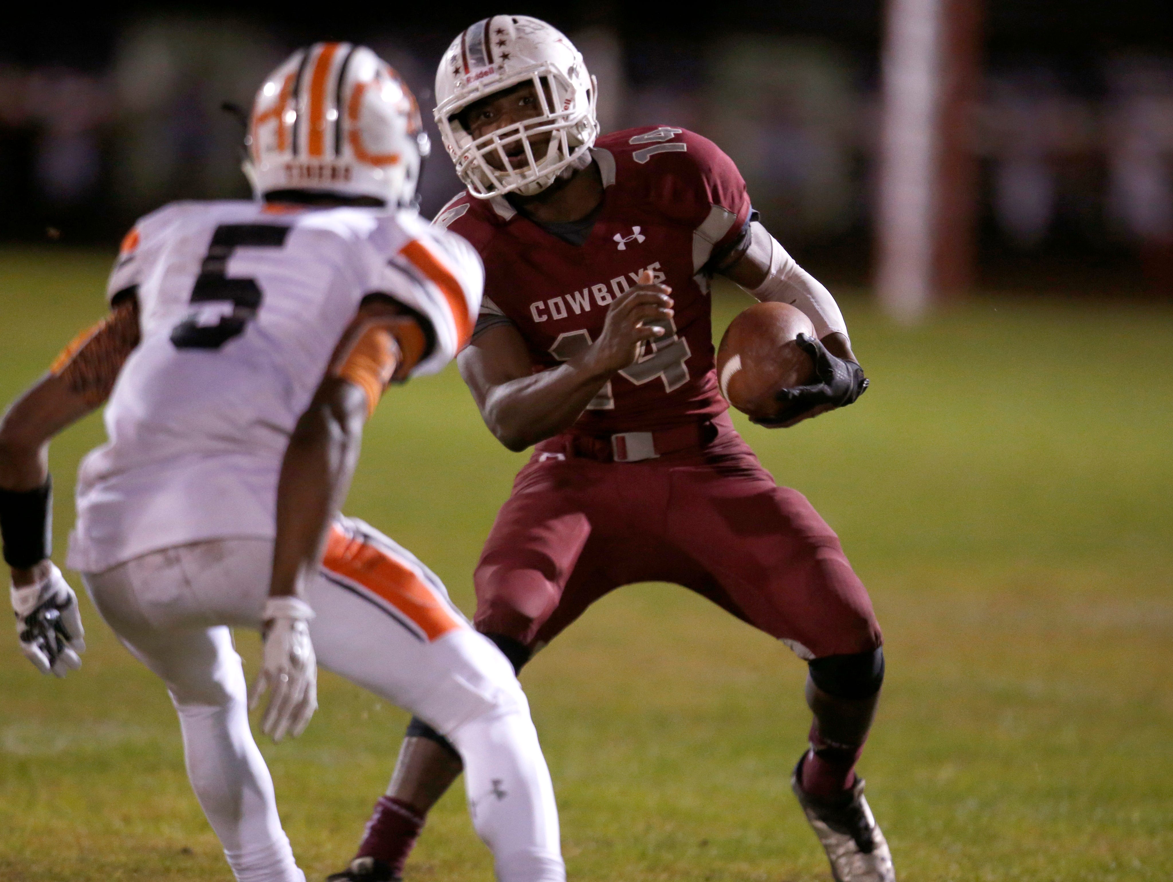 Madison County's Kentwan Daniels tries to get past Trenton defender Hamp Cheevers during their playoff game on Friday.