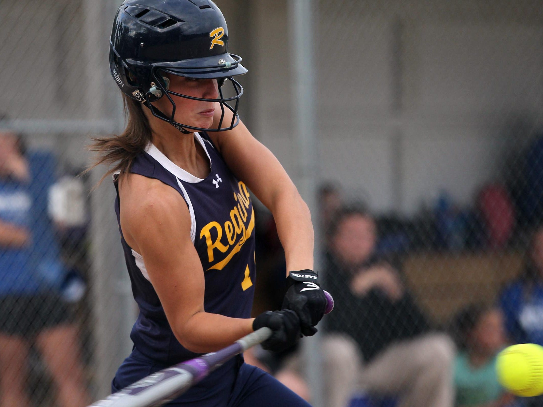 Regina's Cammy Verducci takes a swing during the Regals' game against Columbus on Wednesday, July 8, 2015. David Scrivner / Iowa City Press-Citizen