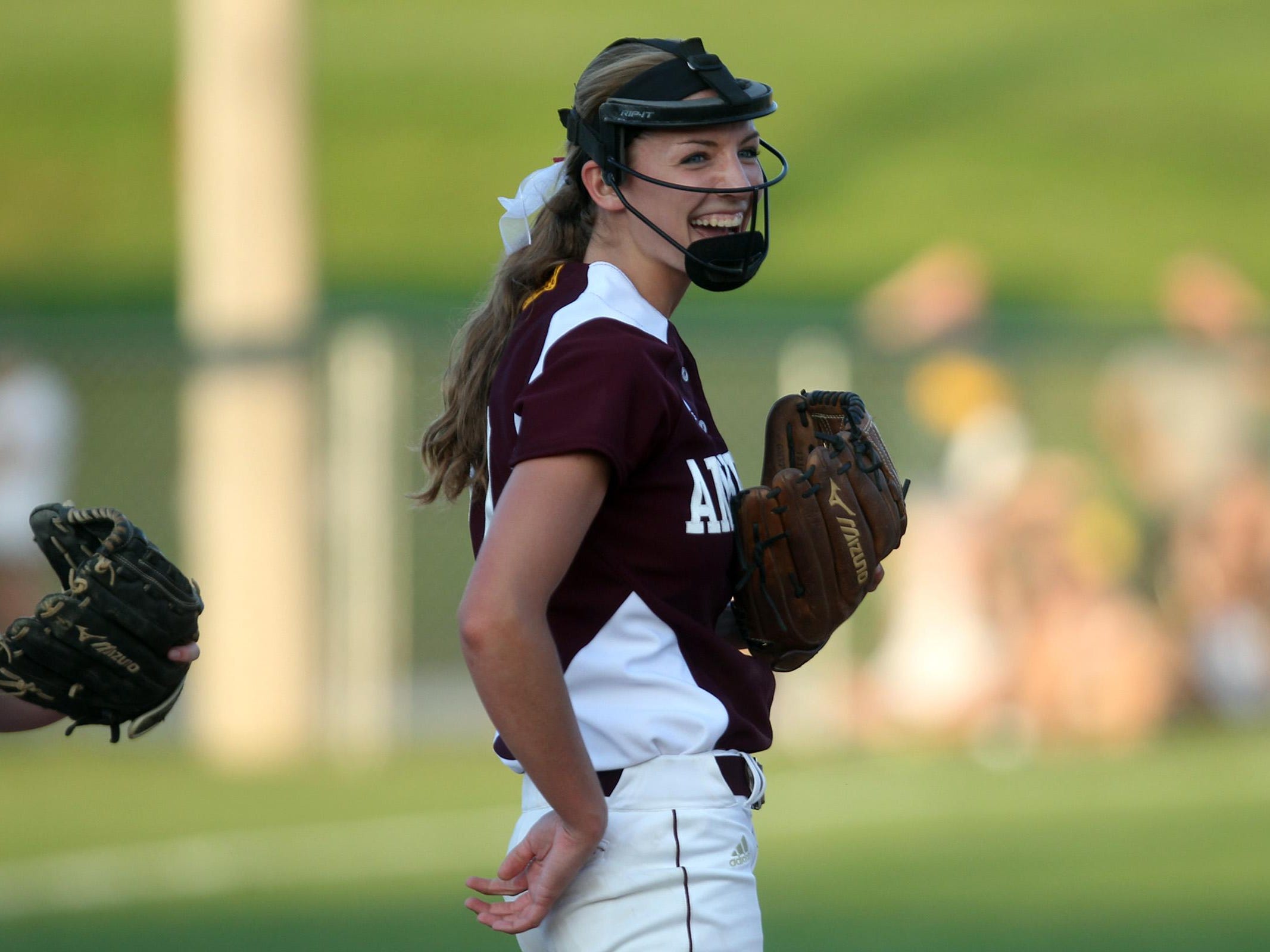 Ankeny pitcher Allison Doocy smiles after a strikeout during the Hawkettes' Class 5A regional championship game at West High on Tuesday, July 14, 2015. Ankeny won, 3-1, to head to state. David Scrivner / Iowa City Press-Citizen