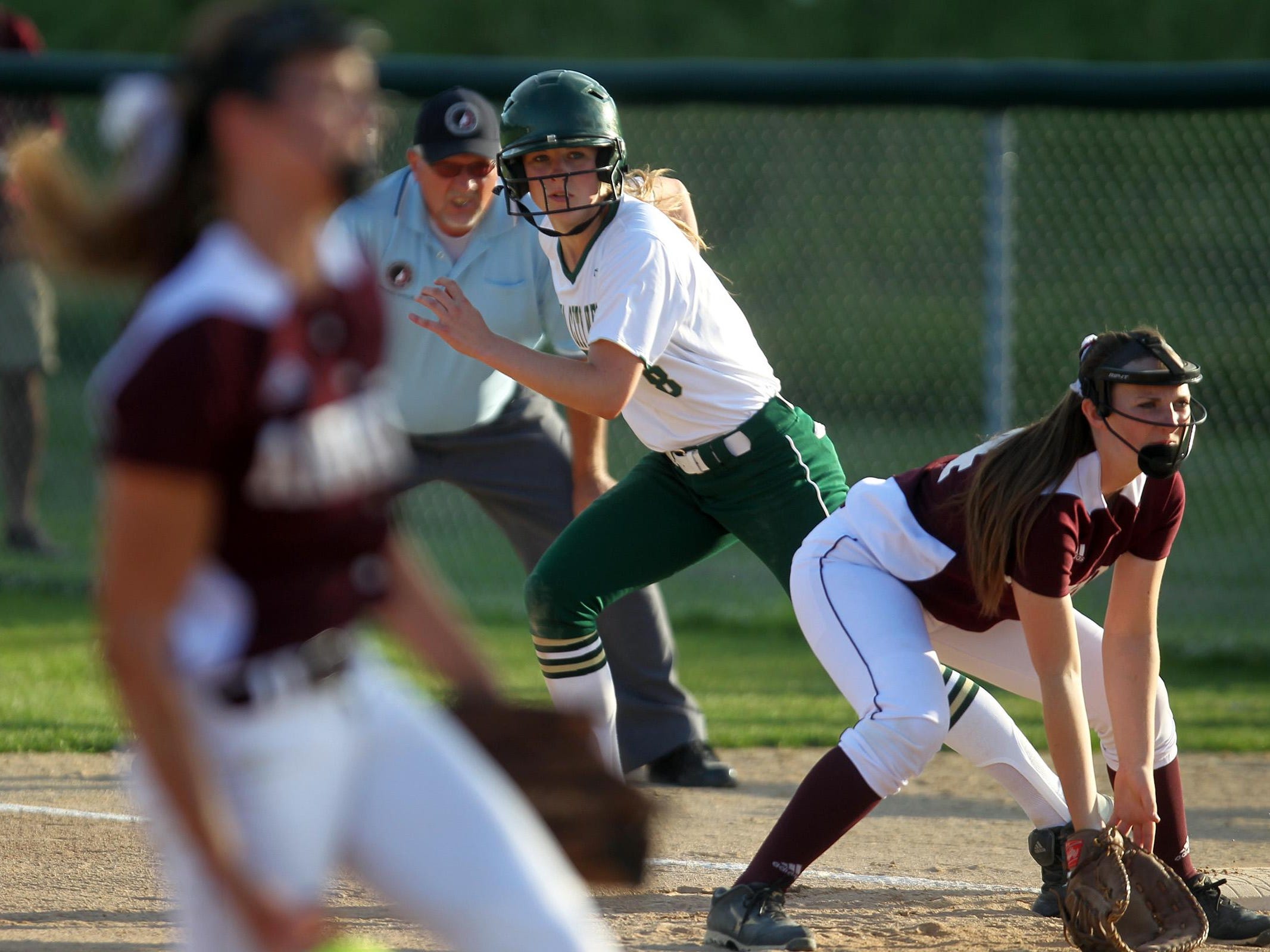 West High's Christine Kallsen leads off first base during the Women of Troy's Class 5A regional championship game against Ankeny at West High on Tuesday, July 14, 2015. Ankeny won, 3-1, to head to state. David Scrivner / Iowa City Press-Citizen