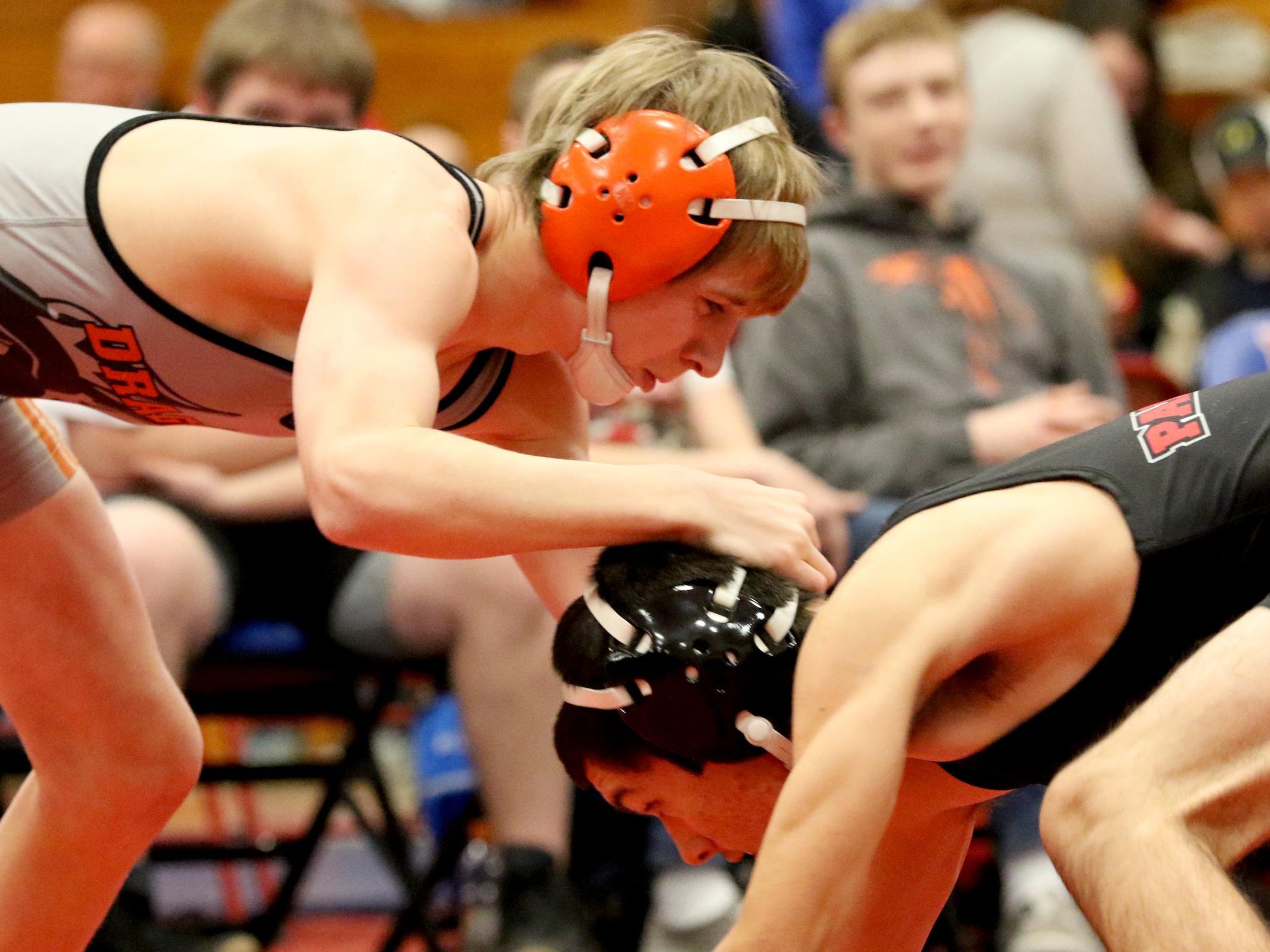 Dallas' Jacob Jones, top, and Central's Michael Arciniega compete in the 113 pound weight class during a wrestling meet at Lebanon High School in Lebanon, Ore., on Wednesday, Jan. 6, 2015.