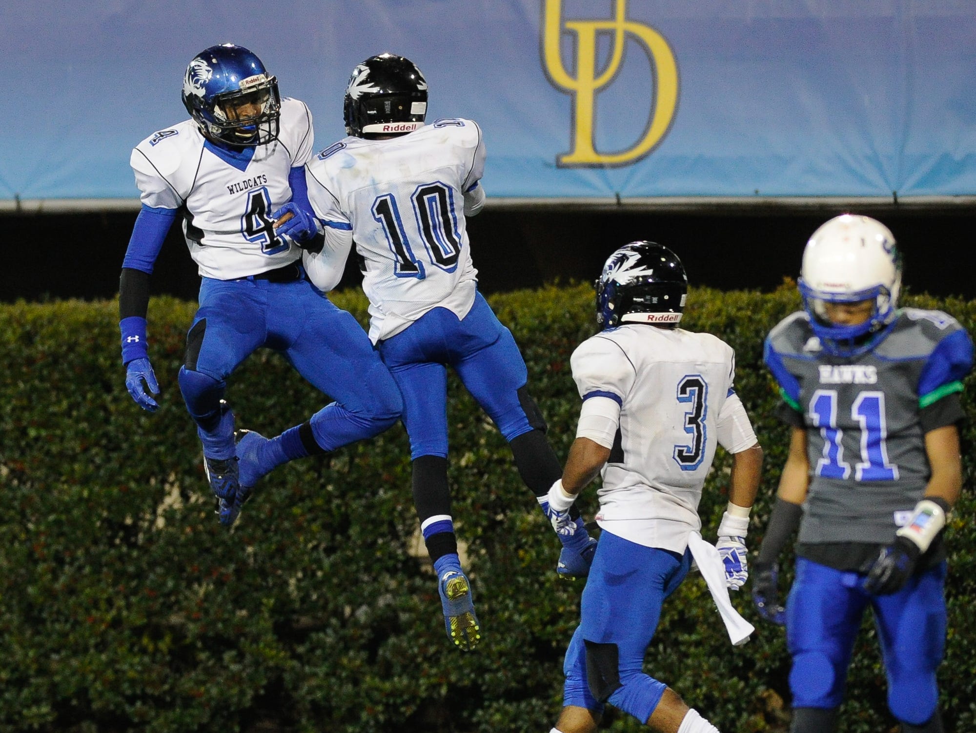 Howard's #4 Earnest Austin and #10 Korey Kent celebrate after scoring against St. George in the Division II championship at the University of Delaware.