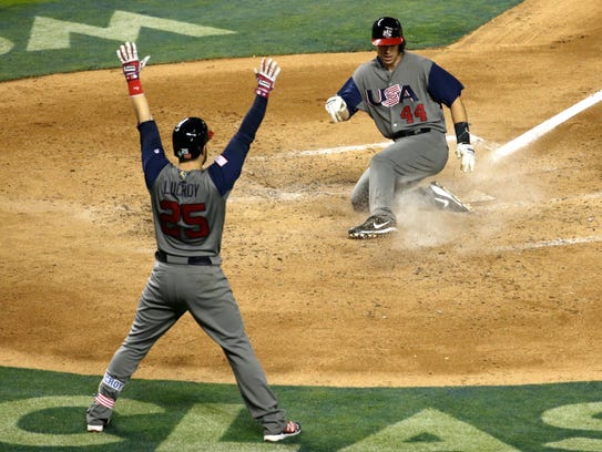 United States' Paul Goldschmidt (44) scores on a hit