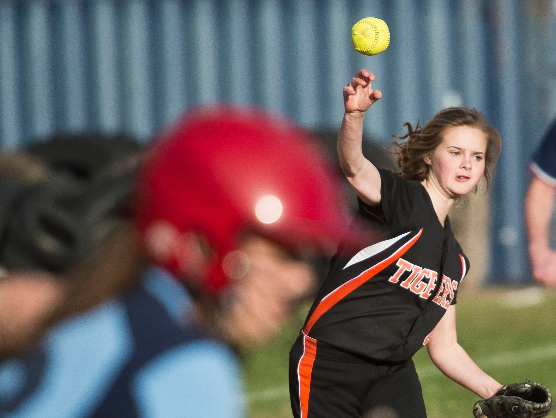 Middlebury's Darcy Staats fields a hit off Mount Mansfield’s Felicia Forsyth, making the throw to first for the out during their softball game on Tuesday in Jericho.