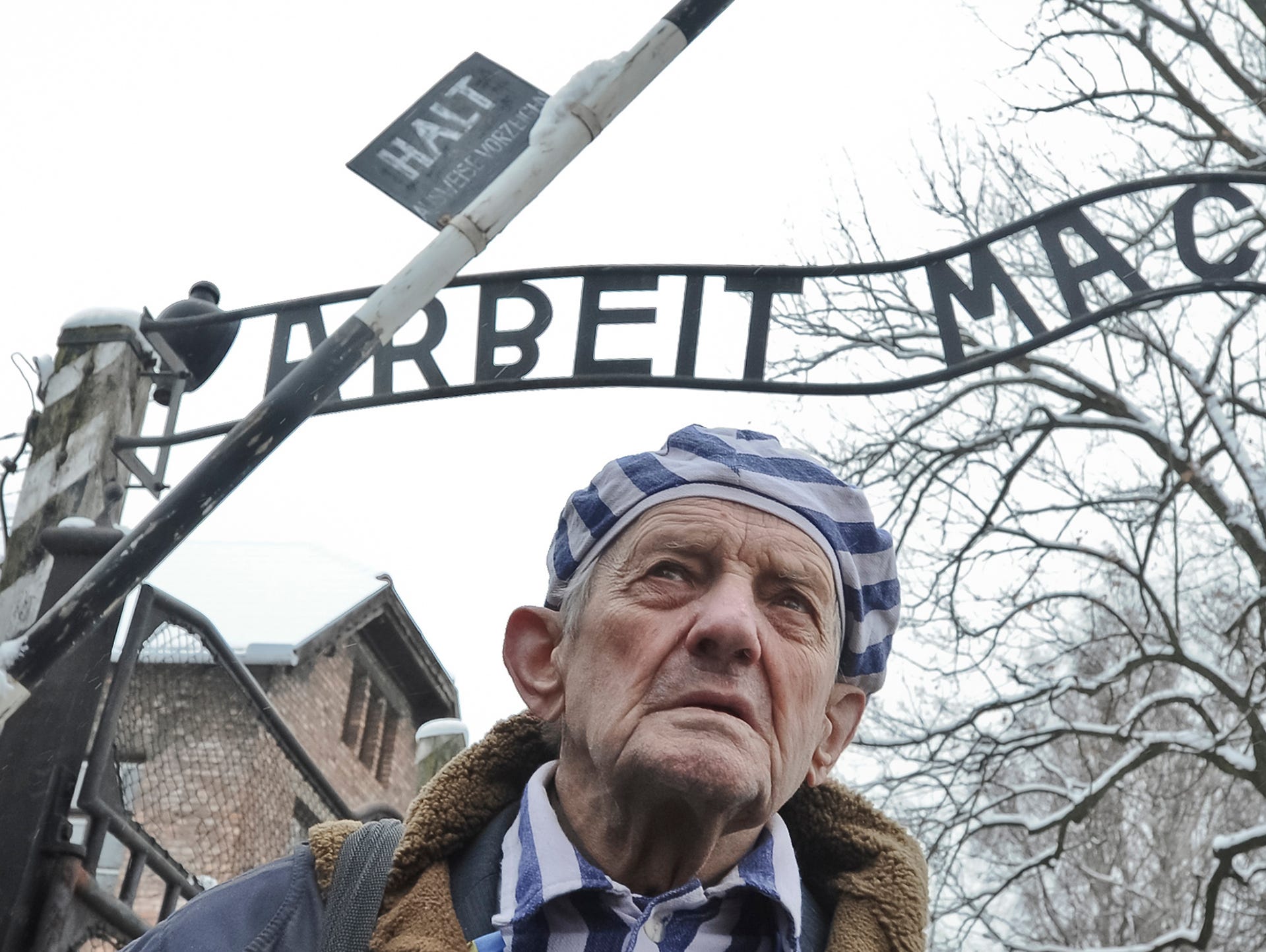 Holocaust survivor Igor Malitsky of Ukraine walks outside