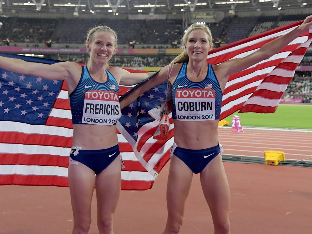 Americans Emma Coburn, right, and Courtney Frerichs celebrate after finishing 1-2 in the 3,000-meter steeplechase at the IAAF world championships in London. Coburn won gold in a U.S. record of 9:02.58, while Frerichs took silver in 9:03.77, the secon