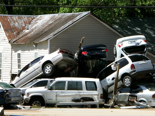 Cars are piled on top of each other after flooding