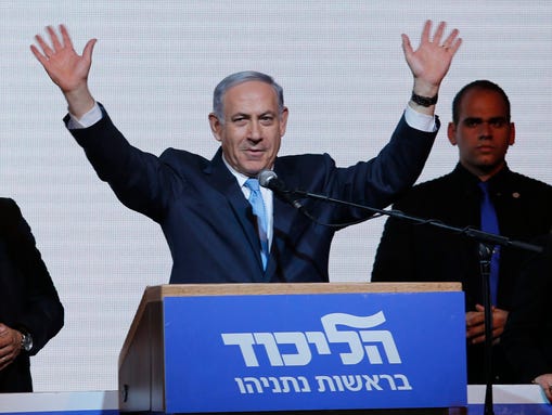 Israeli Prime Minister Benjamin Netanyahu waves to
