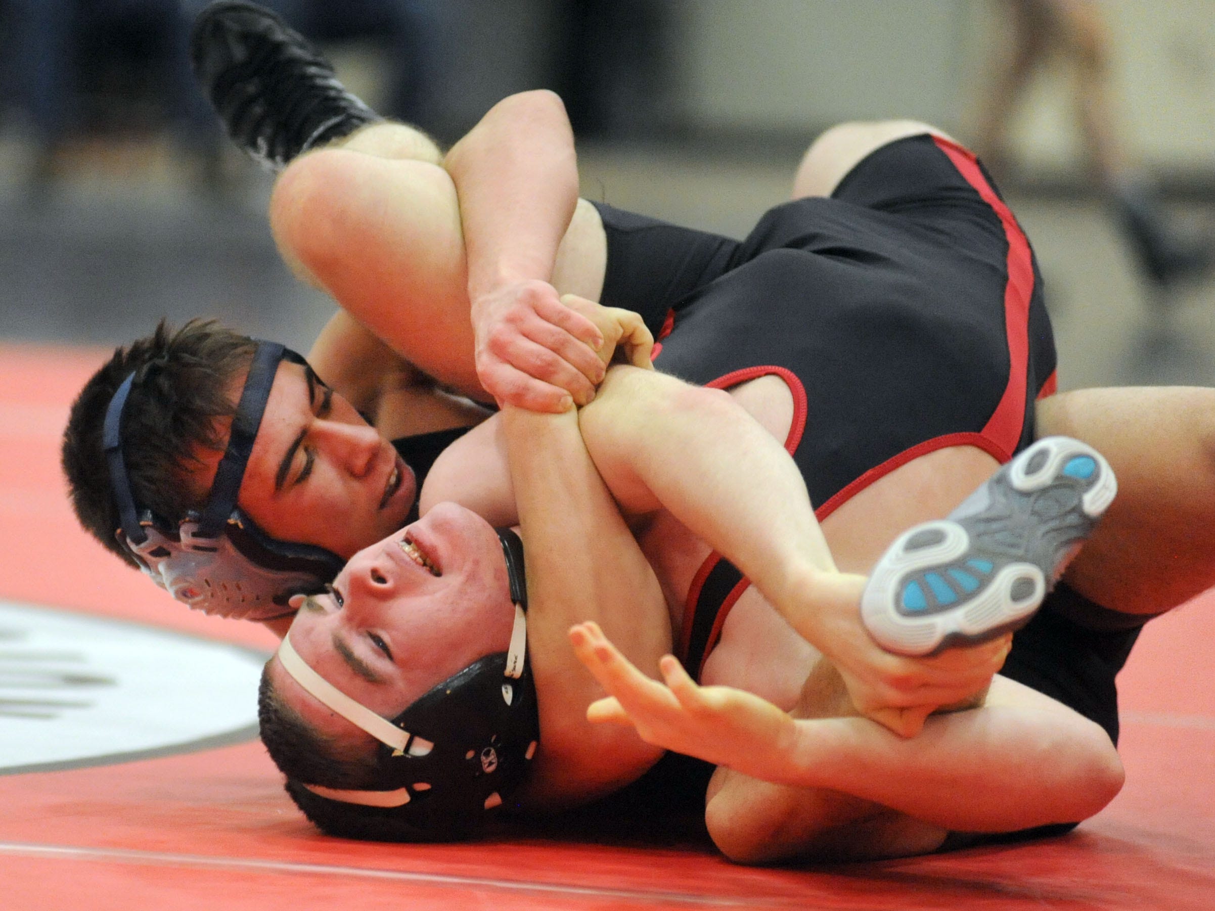 Marion Harding’s Oscar Brasher faced off against River Valley’s Devin Hessler during a first-round bout in the 145-pound division during Saturday’s Mid Ohio Athletic Conference Wrestling Championships at Marion Harding High School.