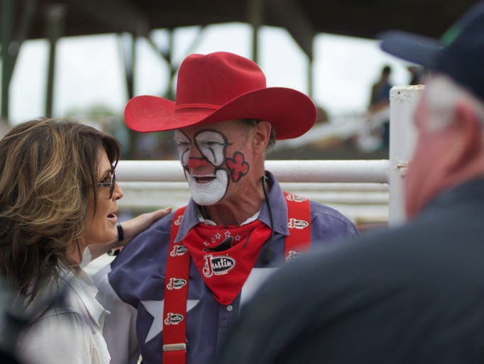 Sarah Palin chats with a rodeo clown at the 88th Annual
