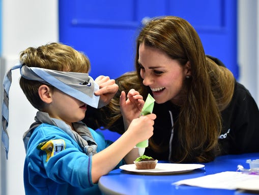 Kate plays with the children at Poplar Beaver Scout