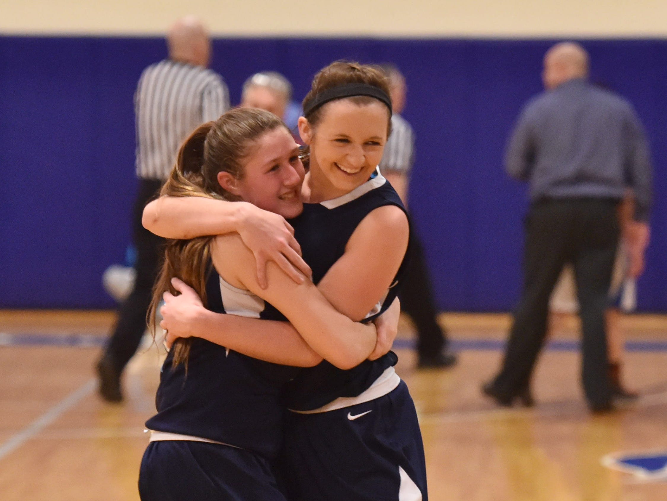 Pine Plains', from left, Tia Fumasoli and Michaella Lamont embrace after winning the Section 9 Class C final versus Seward held at Mount Saint Mary College in Newburgh on Thursday.