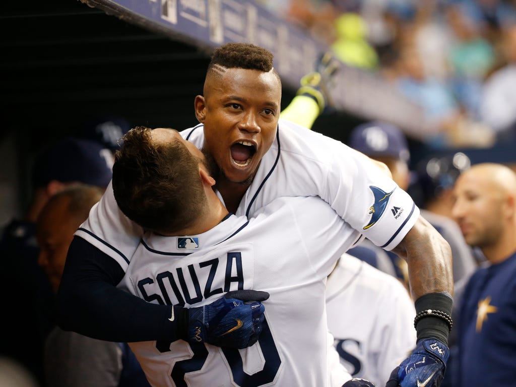 Tampa Bay Rays second baseman Tim Beckham celebrates with right fielder Steven Souza Jr. in the dugout after he hit a 3-run home run during the second inning against the Baltimore Orioles at Tropicana Field in St. Petersburg, Fla.