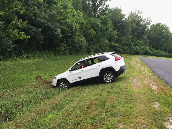 A Jeep Cherokee winds up in a ditch after hackers working with 