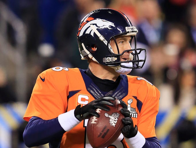 EAST RUTHERFORD, NJ - FEBRUARY 02: Quarterback Peyton Manning #18 of the Denver Broncos drops back to pass during Super Bowl XLVIII at MetLife Stadium against the Seattle Seahawks on February 2, 2014 in East Rutherford, New Jersey. (Photo by Jamie Squire/Getty Images)