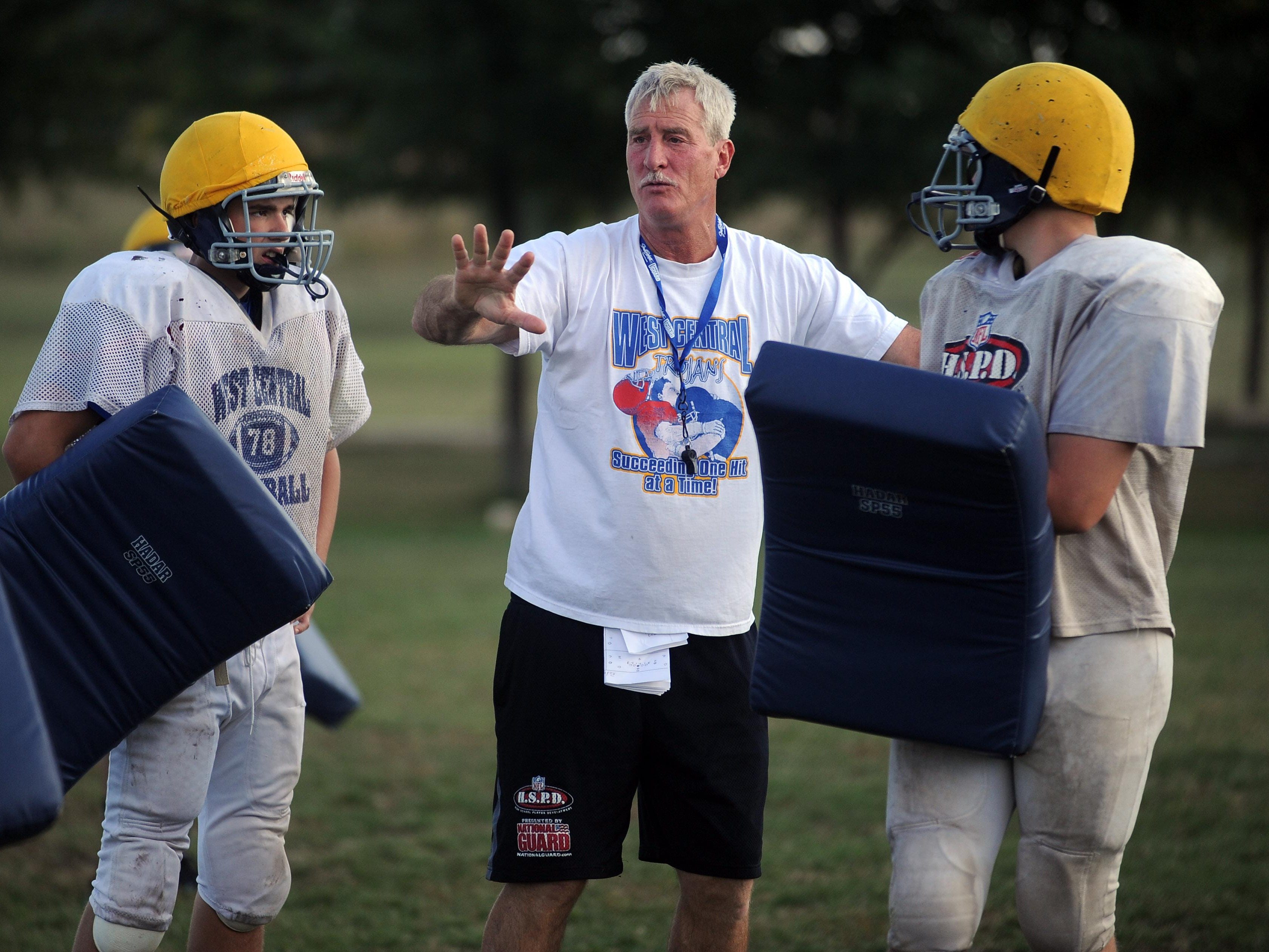 West Central coach Kent Mueller instructs his players during practice in 2013. Mueller’s squad is preparing for a Friday night showdown with Canton, which won the 2013 Class 11B championship.