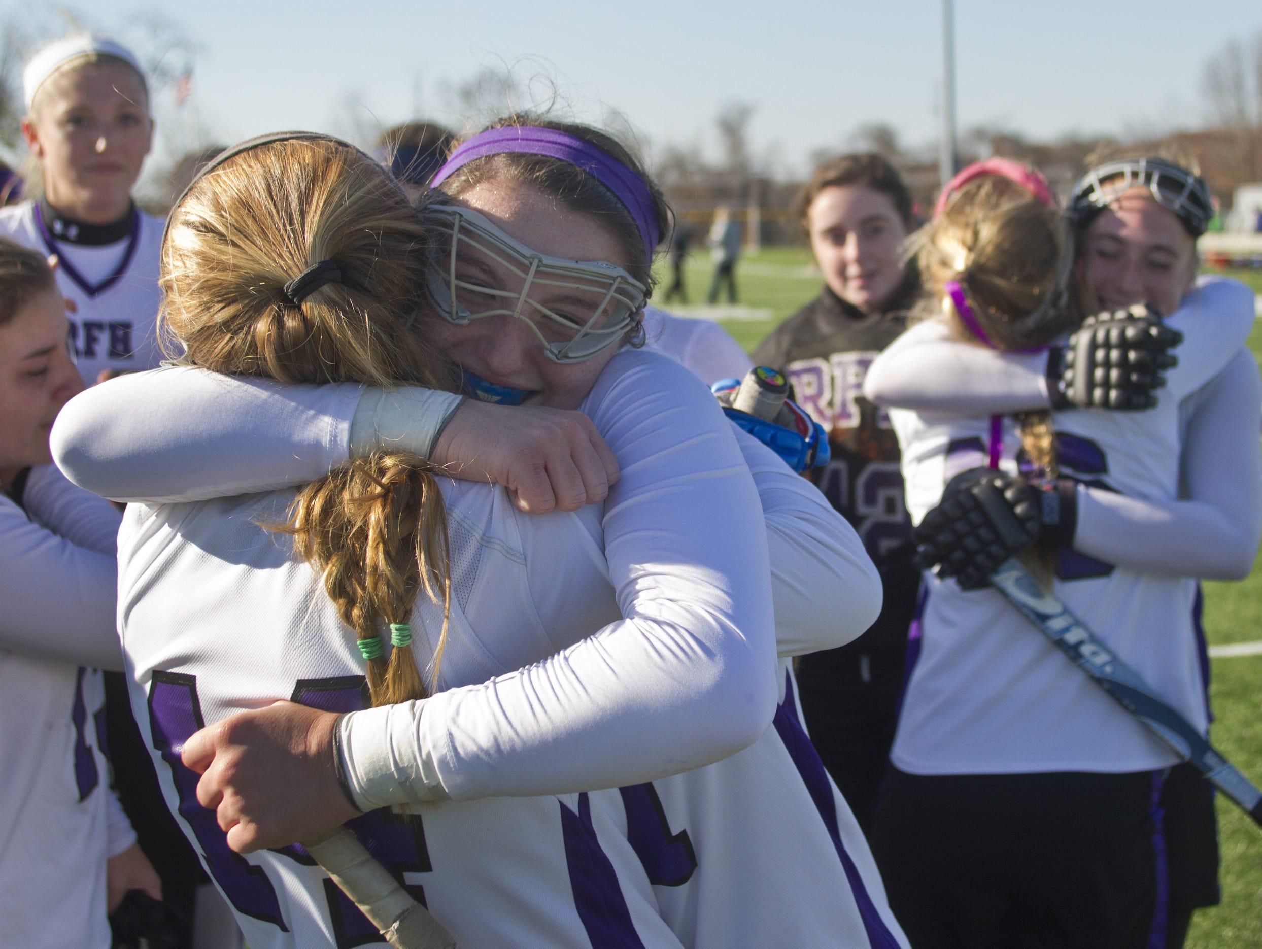 Rumson's Madison Maguire hugs Makenna Maguire after they win their state title over Madison. Madison vs Rumson-Fair Haven NJSIAA Field Hockey Group II Finals in Bordentown, NJ on November 145, 2014. Peter Ackerman /Staff Photographer