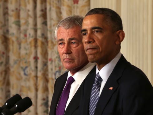 President Obama speaks as Secretary of Defense Chuck Hagel looks on during a press conference announcing Hagel's resignation in the State Dining Room of the White House on Nov. 24, 2014.