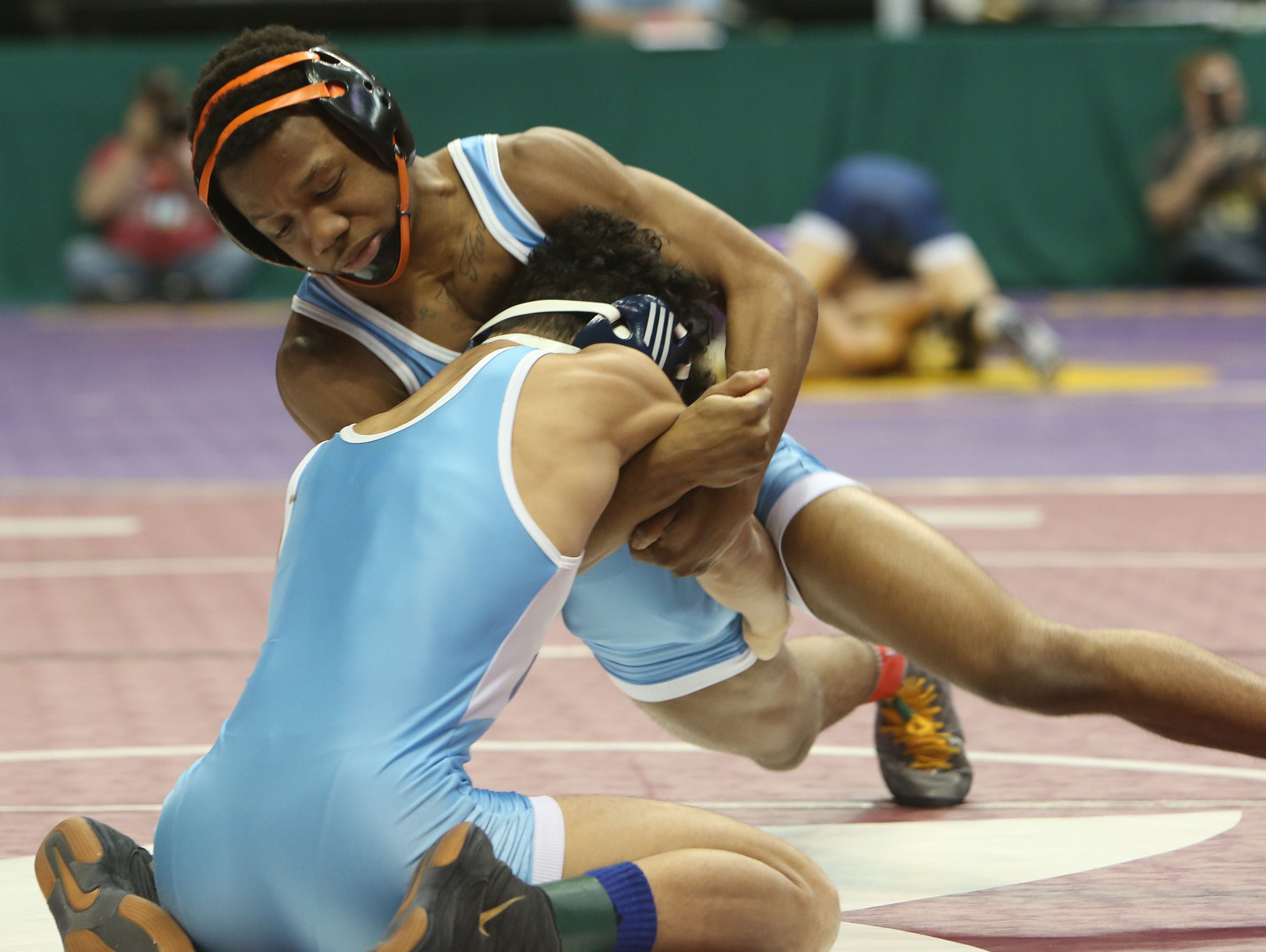 East Ramapo's Trey Wardlaw, top, on his way to defeating Yonkers' Justin Lopez in the 106-pound weight class during the quarterfinals of the New York State wrestling championships at the Times Union Center in Albany Feb. 26, 2016.