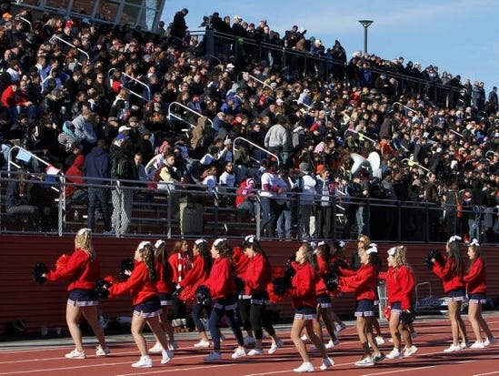 The Stepinac cheerleaders entertain the crowd during the annual Turkey Bowl at White Plains High School Nov. 24, 2011. Stepinac won the game 38-14.