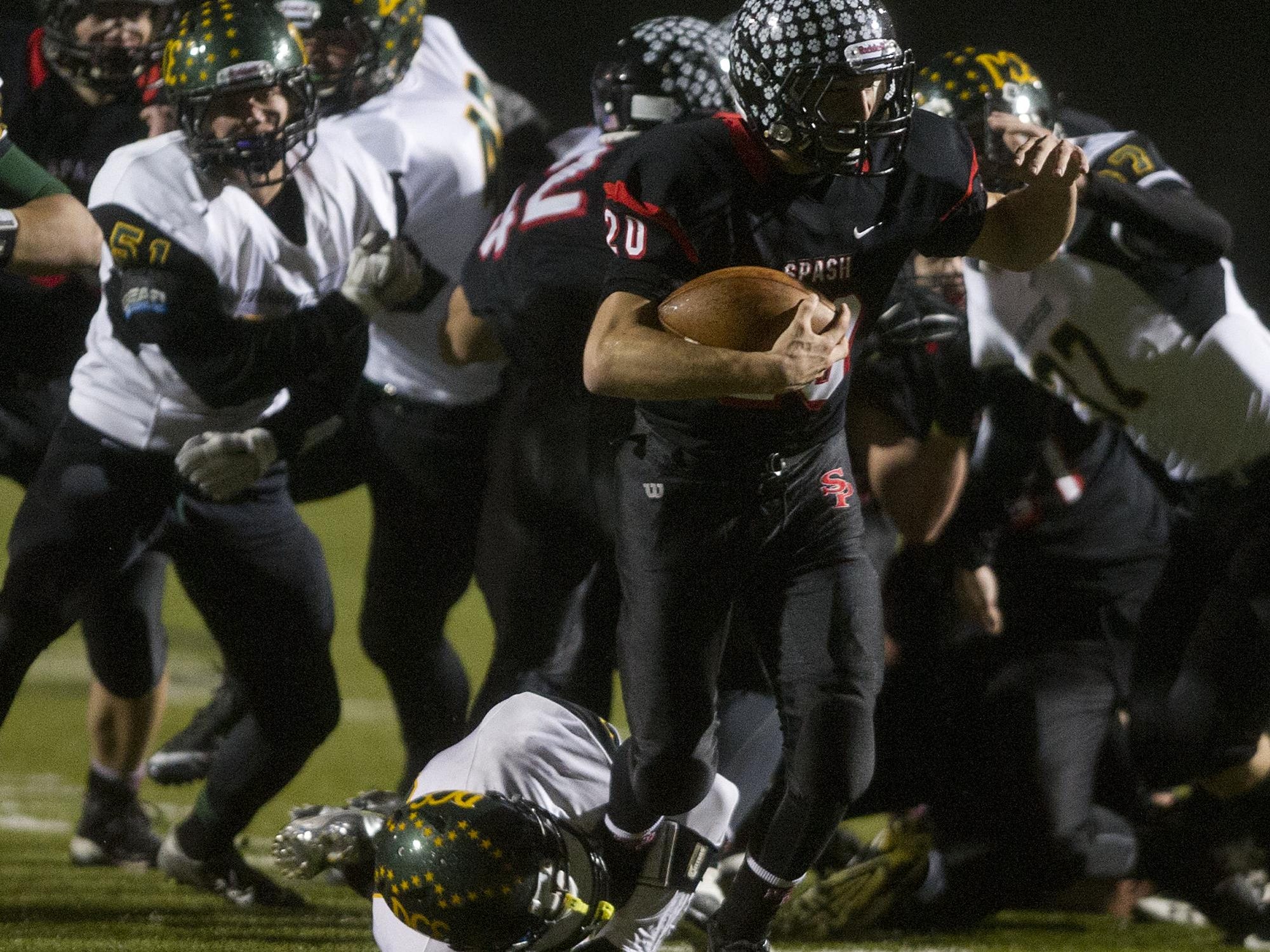 Stevens Point Area Senior High’s Gus Turner-Zick carries the ball Friday during a WIAA Division 1 playoff game against D.C. Everest at Goerke Field in Stevens Point.