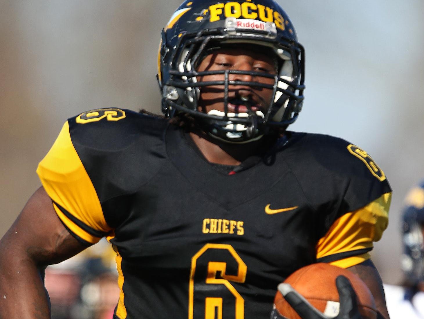 Piscataway football's Zaire Ashley runs in for a touchdown against Ftra.