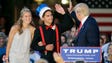 Trump high-fives homecoming king Austin Cook as queen