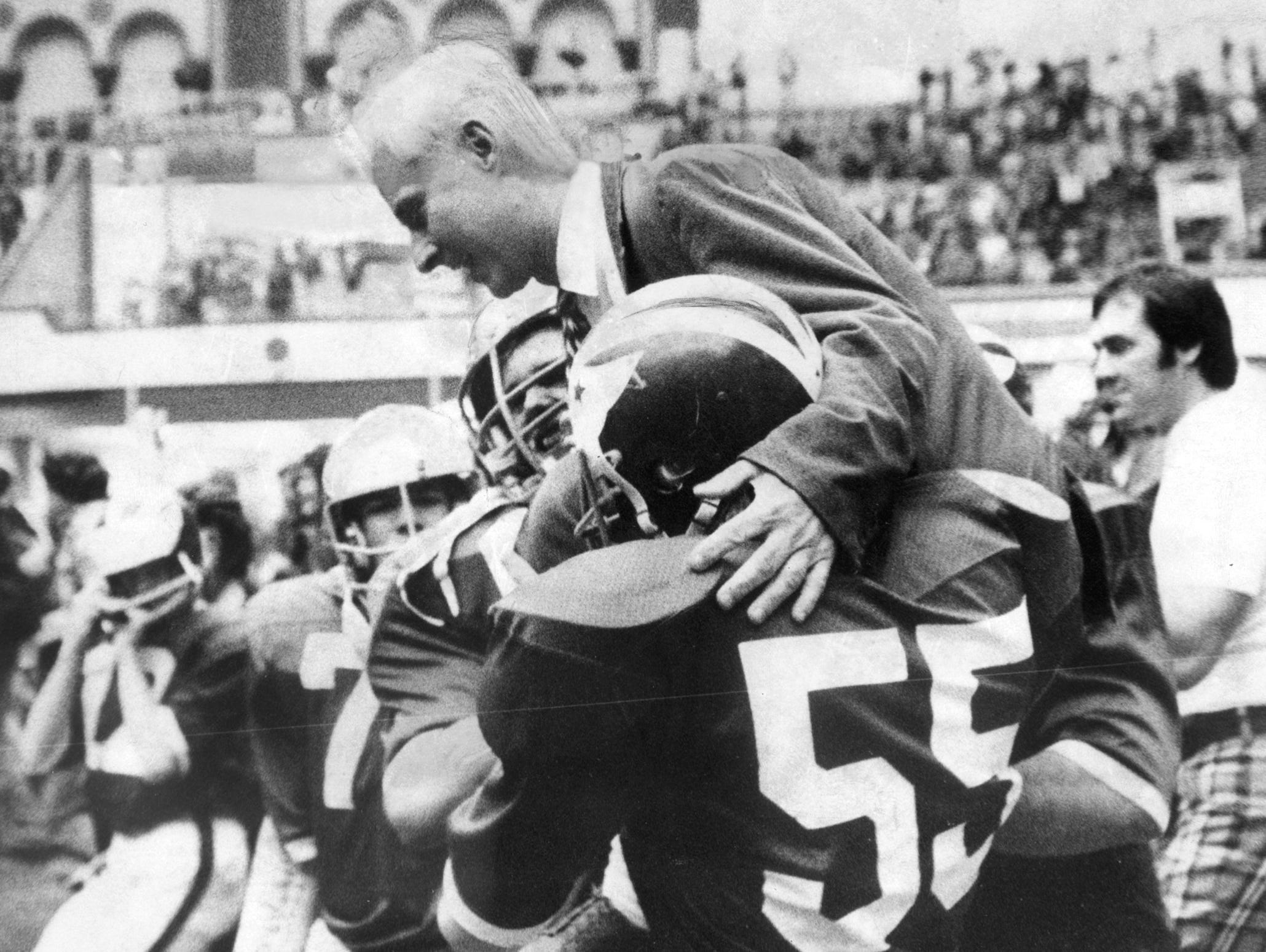 Brick players hoist coach Warren Wolf on their shoulders after the Green Dragons' victory over Camden in the 1974 NJSIAA South Jersey Group IV championship game in Atlantic City, the first year of high school football playoffs in the state.