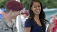 Malia Obama smiles as she serves food during a lunch