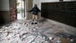 Jorge Sanchez looks over damage to the main Post Office following in Napa.