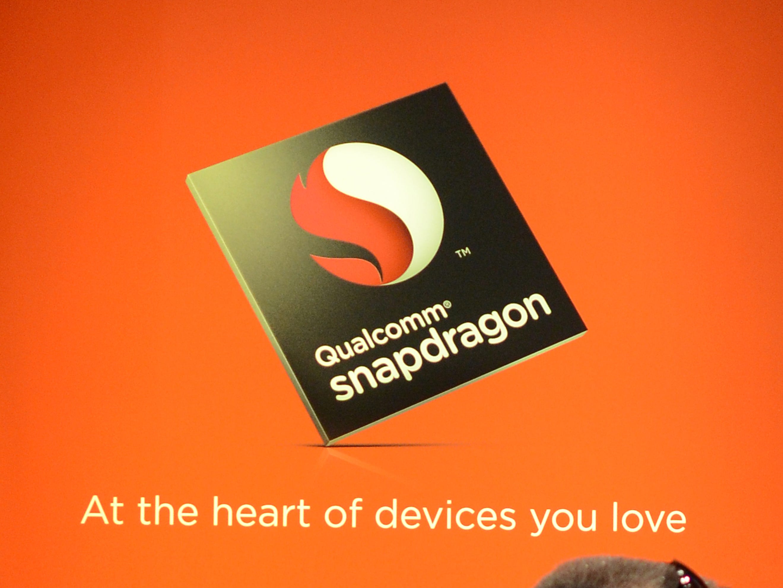 Consumers visit the Qualcomm booth during the 2013 International CES in Las Vegas.