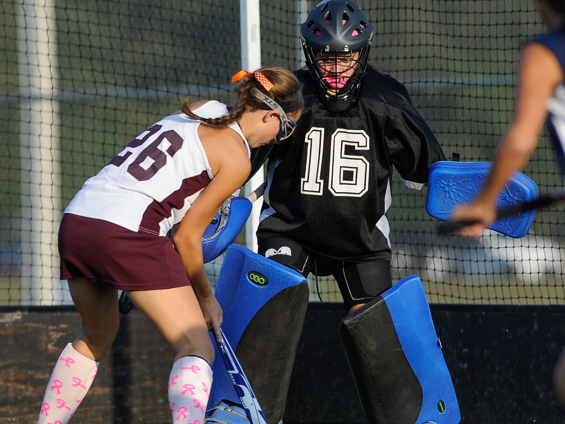 Lake Forest field hockey goalie Allison Bishop (No. 16) defends in their game against Milford.