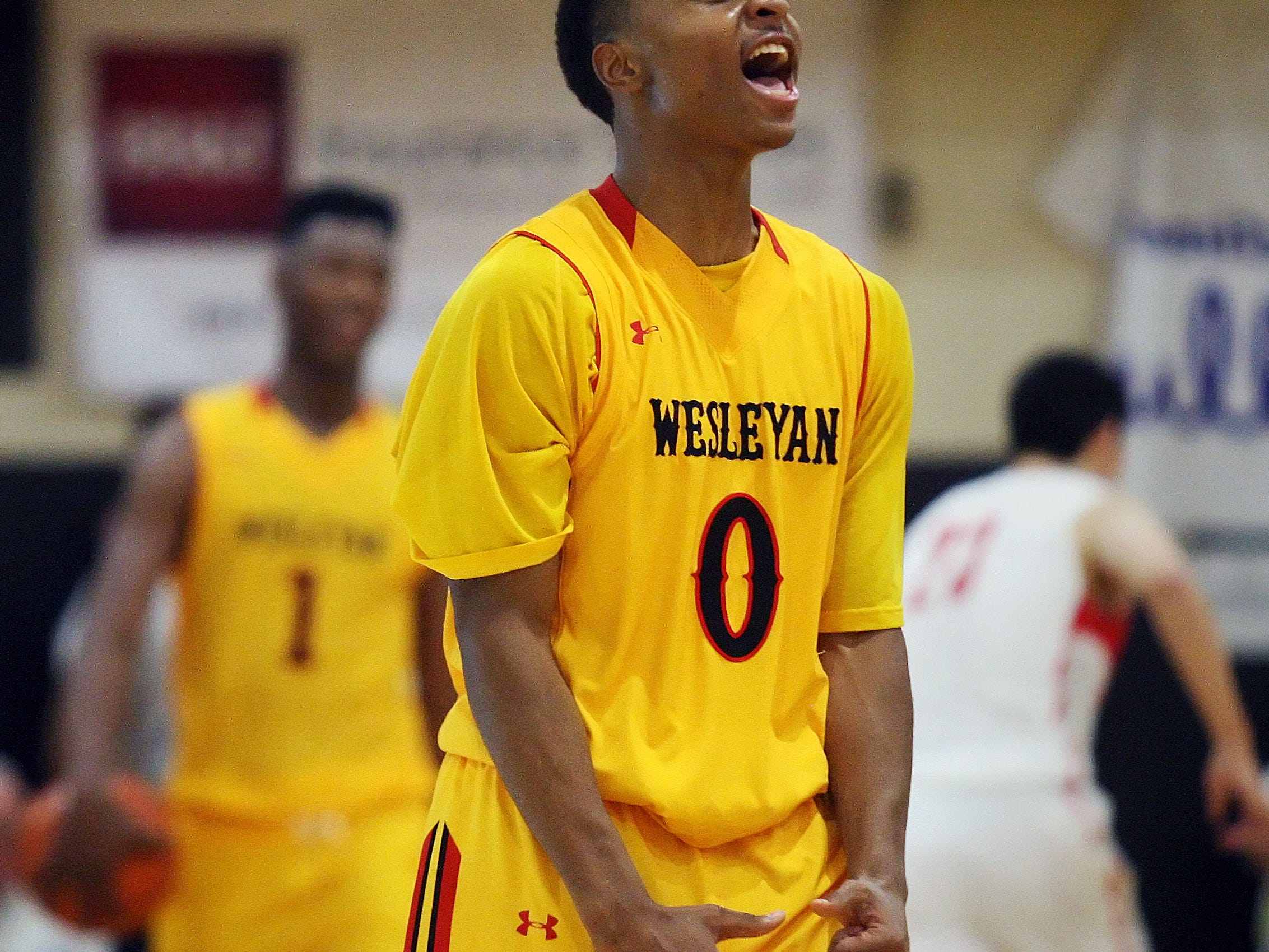 KINFAY MOROTI/THE NEWS-PRESS.. Wesleyan Christian's Bradon Childress celebrates beating Mater Dei in their quarterfinal game Saturday (12/20/14) during the 42nd Annual Culligan City of Palms Classic at Bishop Verot High School in Fort Myers. Wesleyan Christian beat Mater Dei 67-62.