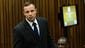 Oscar Pistorius enters court on the second day of his trial.