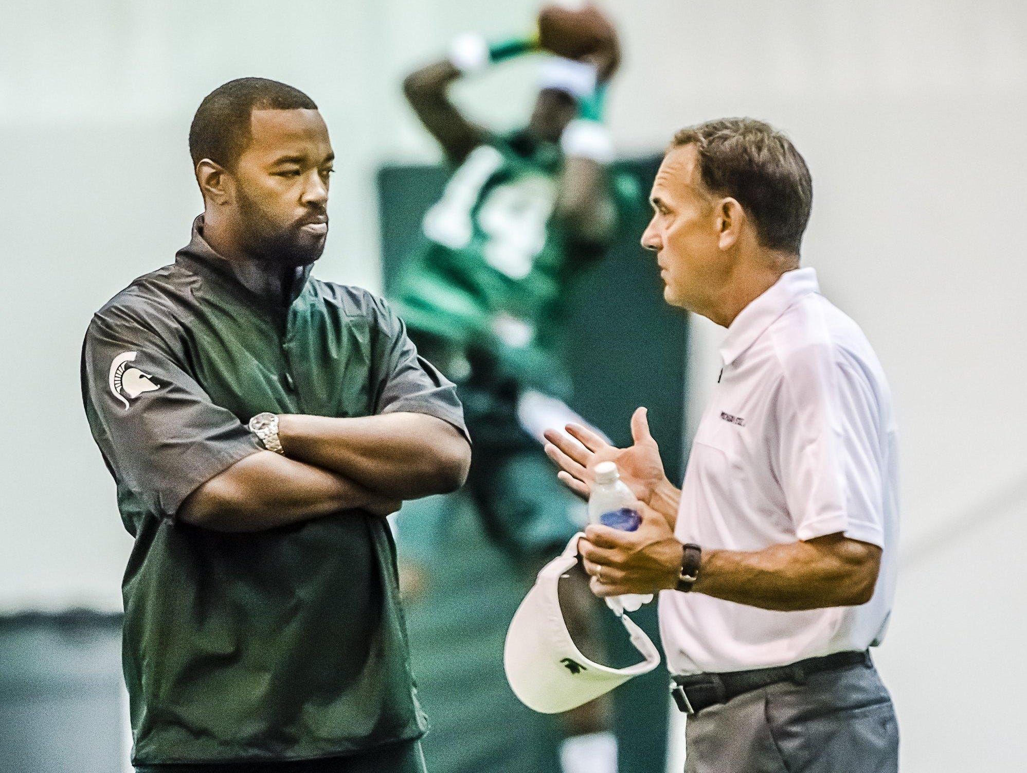 Curtis Blackwell, left, coordinates recruiting for MSU coach Mark Dantonio. The process has changed since Blackwell went through it.