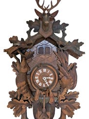 This West German hand-carved wooden Cuckoo Clock recently