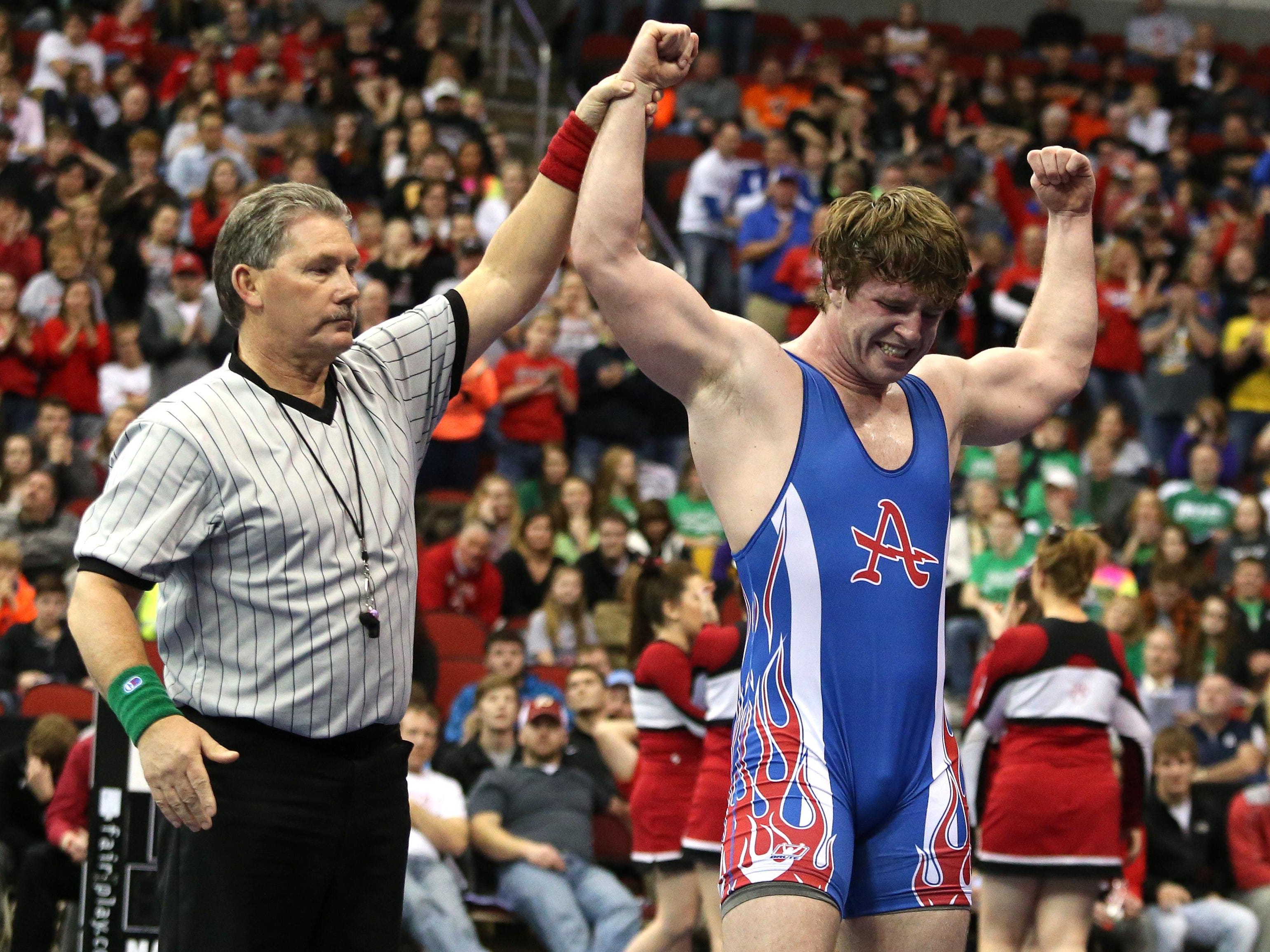Albia junior Carter Isley celebrates after he won the title at 220 pounds in Class 2A over Hampton-Dumont senior Kendrick Suntken on Saturday, Feb. 21, 2015, during the 2015 Iowa state wrestling championships at Wells Fargo Arena in Des Moines, Iowa.