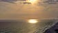 The sun appears to spotlight the ocean in Panama City