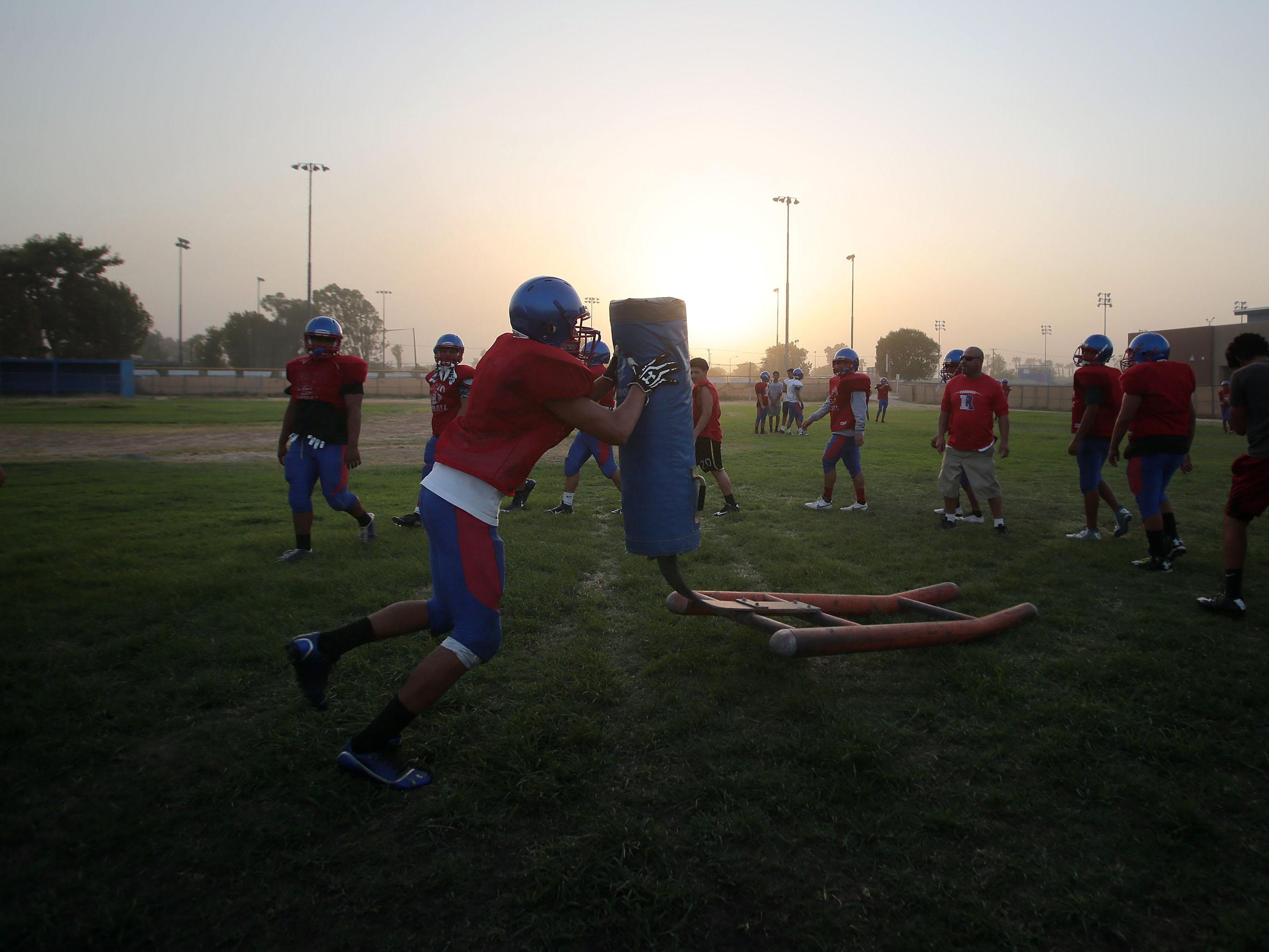 The Indio High School football team practice on Tuesday, August 18, 2015.