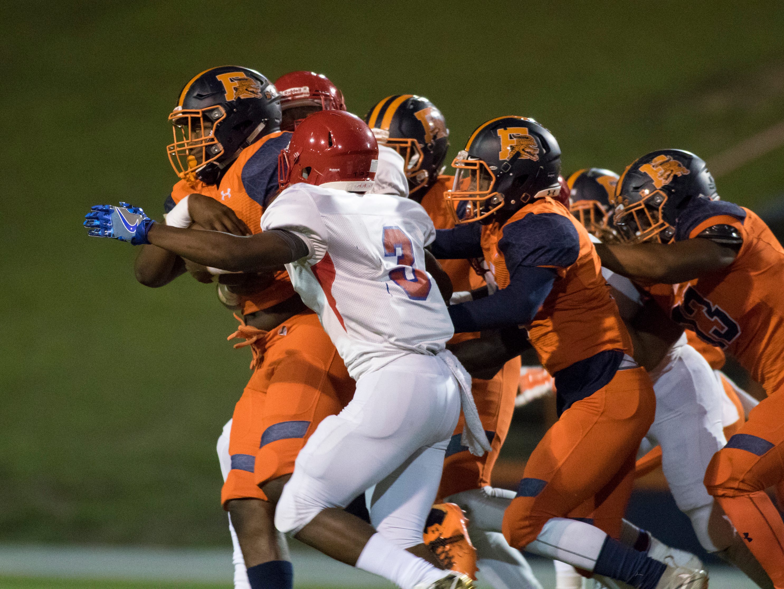 Escambia's Amarqez Moore (10) carries the ball during the Pine Forest v Escambia football game on Friday, September 30, 2016.