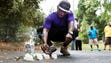 Jermaine Hicks lights a candle at a small memorial