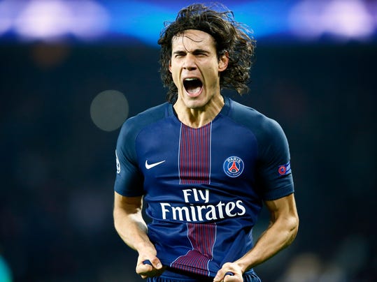 PSG's Edinson Cavani celebrates scoring his team's forth goal of the game during the Champion's League round of 16, first leg soccer match between Paris Saint Germain and Barcelona at the Parc des Princes stadium in Paris, Tuesday, Feb. 14, 2017. (AP Photo/Francois Mori)
