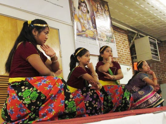 A group of Nepali girls perform a combination of traditional