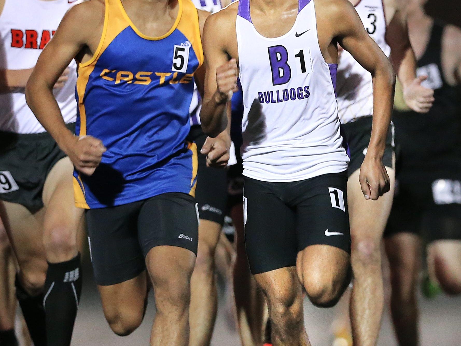 Brownsburg's Hari Sathyamurthy, right, won the Boys Miracle Mile Heat 3 race during the 2015 Flashes Showcase Invitational at Franklin Central High School on April 17, 2015.