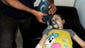A Syrian girl gets treated at a makeshift hospital in Arbeen town, Damascus, in an image provided to the Associated Press, which authenticated the image independently.